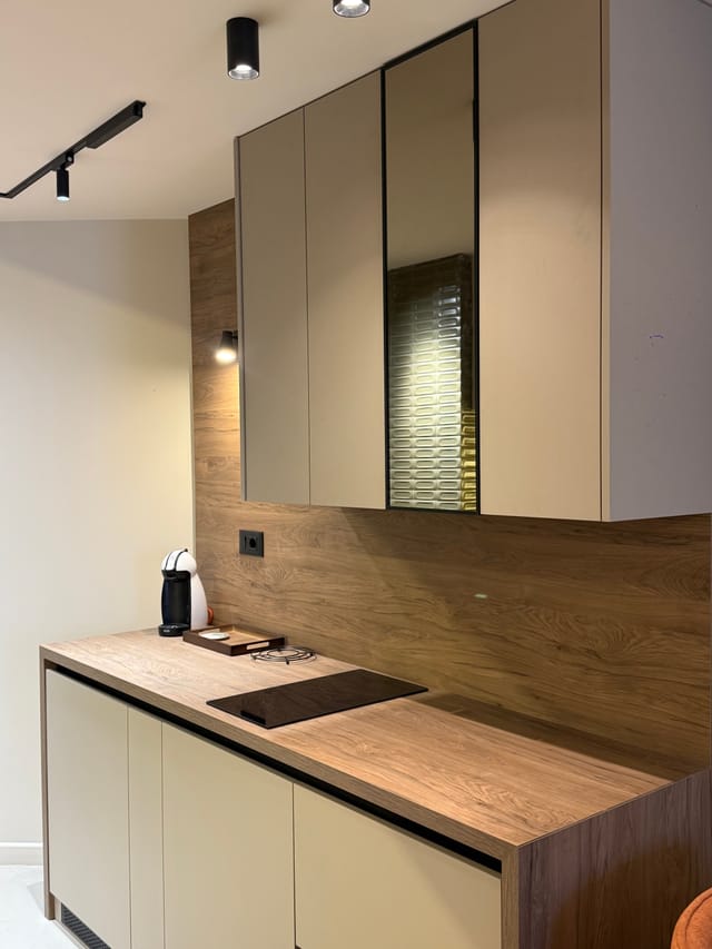 Dining area reflected in the full-height mirror